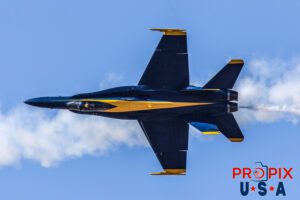 Blue Angels F-18 Hornet performing a high speed opposing pass at the 2017 Sun N Fun airshow in Lakeland Florida. The smoke behind the aircraft is from the F-18 that had just passed moments before. #5 Commander Frank Weisser: Lead Solo Aircraft code F18.