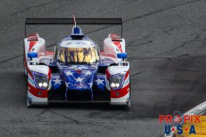 Reflecting on the race.. This LMP2 is about to nip the rumble strips of the apex as it is nearing entry to the banking section of Daytona International Speedway. The reflection of the late afternoon light on the windshield was quite spectacular.