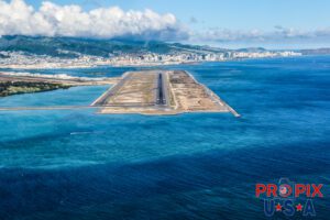 Honolulu International airport's 8L runway which is a staggering 12,312' long. This is primarily used for departing flights as long duration flights require a lot of fuel, thereby needing additional runway to take off at appropriate speeds.