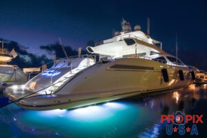 Just chip in for gas..! Yacht docked at a marina at sunrise.