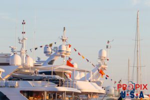 Sunrise on the aft decks of multiple mega yachts.