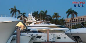 Yachts docked at a marina in the early morning hours.