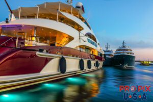 Yachts docked at sunrise and the water currents evident.