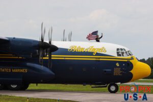 The USMC's Fat Albert taxis to the runway to begin it's performance at the 2025 Brunswick Georgia airshow. Staff Sargent Colin Handlen (USMC) has opened the upper deck hatch and is seen waving to the crowd. Major Petko can be seen in the right seat and Captain Becker can be seen in the left seat. Major Samuel Petko (USMC) Captain Isaac Becker (USMC) Major Josh Horman (USMC) Aircraft code: C130 Aircraft identifier: BERT10 Airport code(s): BQK, KBQK Photo Date: 5-17-2025