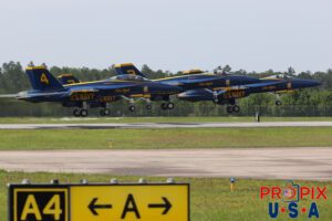 A DISAPPOINTING FAREWELL..! Approximately an hour before this photo was taken at the 2025 Brunswick Georgia airshow, the organizers canceled the final performances (F-22 demo team and The Blue Angels) due to a brief rain shower. There were a lot of disappointed and upset people. Looking carefully into the #4 aircraft, you'll notice a lucky passenger who's videoing the departure on a phone. Aircraft code: F18 Airport code(s): BQK, KBQK Photo date: 5-18-2025