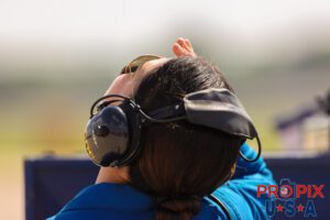 It's up to the doc.. Blue Angels Flight Surgeon Captain Jen Murr watching the performance of the Navy demonstration team at the 2025 Smyrna Tennessee air Show. Airport code(s): MQY, KMQY Photo date: 6-8-2025