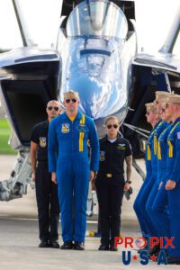 Passing by to pick up the Boss..! Commander Bryan along with Petty Officers Alexander and Kendrick standing at attention as the five other Blue Angels pilots pass by aircraft #1 to complete their demonstration. #1 Commander Adam Bryan (Commanding Officer) #2 Commander Jack Keilty (Right Wing) #3 Major Brandon Wilkins (Left Wing) #4 Lieutenant Commander Wes Perkins (Slot) #5 Commander Thomas Zimmerman (Lead Solo) #6 Lieutenant Commander Connor O'Donnell (opposing Solo) Aircraft code: F18 Airport code(s): MQY, KMQY Photo date: 6-8-2025