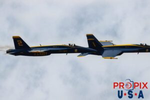 Seen are two of the four Blue Angels performing the "Diamond Half Cuban Eight Break Out" at the 2025 Brunswick Georgia airshow. #1 Commander Adam Bryan (Commanding Officer) #2 Commander Jack Keilty (Right Wing) Aircraft code: F18 Airport code(s): BQK, KBQK Photo date: 5-17-2025