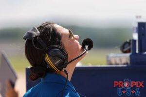 Always smiling, Blue Angels team Flight Surgeon Captain Jen Murr watching the performance of the Navy demonstration team at the 2025 Smyrna Tennessee air Show. Airport code(s): MQY, KMQY Photo date: 6-8-2025