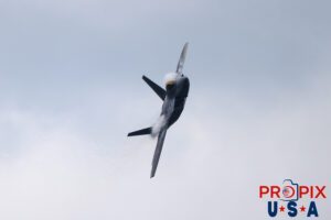 F-22 Raptor performing rapid banking turn with contrails forming around and on the wings of the aircraft at the 2025 Brunswick Georgia airshow. Aircraft code: F22 Airport code(s): BQK, KBQK Photo Date: 5-17-2025