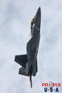 F-22 Raptor performing a vertical climb with afterburners engaged and contrails flowing past the aircraft at the 2025 Brunswick Georgia airshow. Aircraft code: F22 Airport code(s): BQK, KBQK Photo Date: 5-17-2025