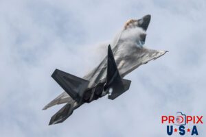 F-22 Raptor performing an ascent where vapor clouds are seen forming around the top of the aircraft at the 2025 Brunswick Georgia airshow. Aircraft code: F22 Airport code(s): BQK, KBQK Photo Date: 5-17-2025