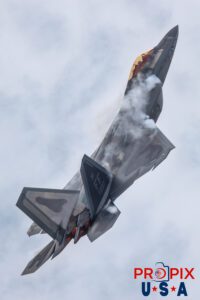 F-22 Raptor performing a rapid ascent with afterburners engaged and vapor clouds forming around the top of the aircraft at the 2025 Brunswick Georgia airshow. Aircraft code: F22 Airport code(s): BQK, KBQK Photo Date: 5-17-2025