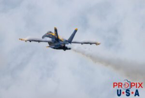 Blue Angel #6 has just taken off to start the show and is performing the "Low Transition / Immelmann on Takeoff" #6 Lieutenant Commander Connor O'Donnell (opposing Solo) Aircraft code: F18 Airport code(s): BQK, KBQK Photo date: 5-17-2025