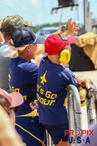 Presumed friends and family members of Blue Angels #3 waving to the pilot as he passed by to commence the 2025 Smyrna Tennessee air show. Airport code(s): MQY, KMQY Photo date: 6-8-2025