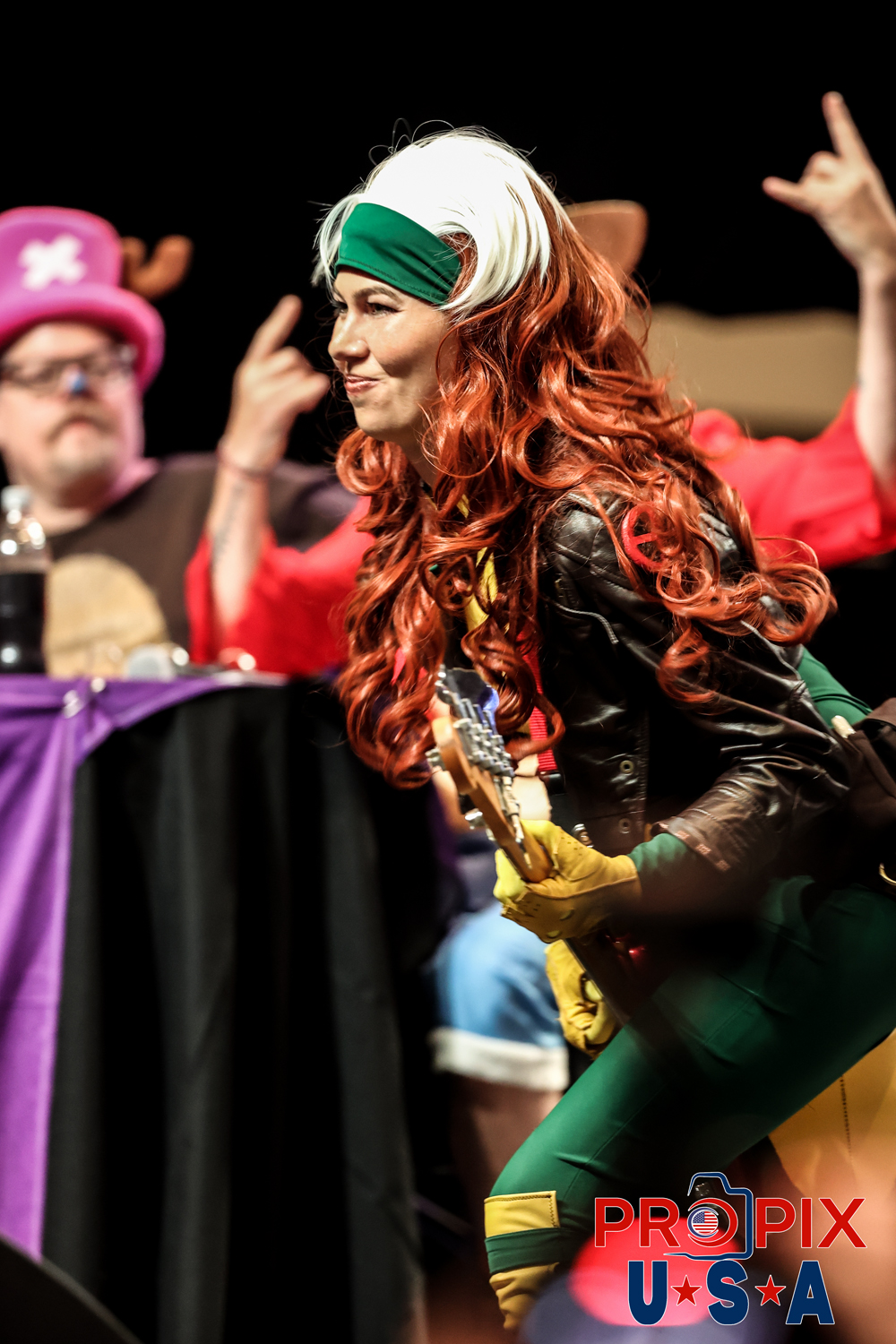 Dragon Con Masquerade 2025. The song "The Ace of Spades being performed next to Tony Gowell and Eddie McClintock . (one of our favorite photos). Photo date: 8-31-2025 Dragoncon