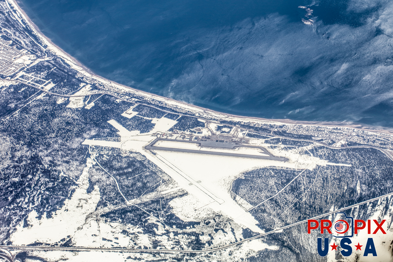 Aerial photo of Sept-Iles airport Quebec Canada CYZV in April. Still a lot of snow in mid April. This airport is only feet away from the Atlantic Ocean. It is also at the Northern tip and beginning of the Saint Lawrence Seaway Photo date: 4-14-2025
