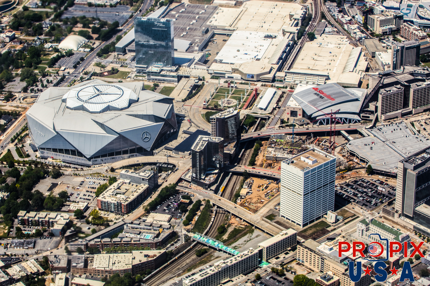 Aerial photo of Atlanta Georgia Mercedes Benz Stadium, State Farm Arena area and the Georgia World Congress Center Convention Hall. Photo date: 4-14-2025