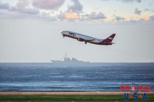 N403YK 1992 Boeing 737 B737 Northern Air Cargo U.S. Navy Destroyer in background on it's way into Pearl Harbor. HNL (PHNL) Honolulu Hawaii International Airport Photo date: 10-19-2024