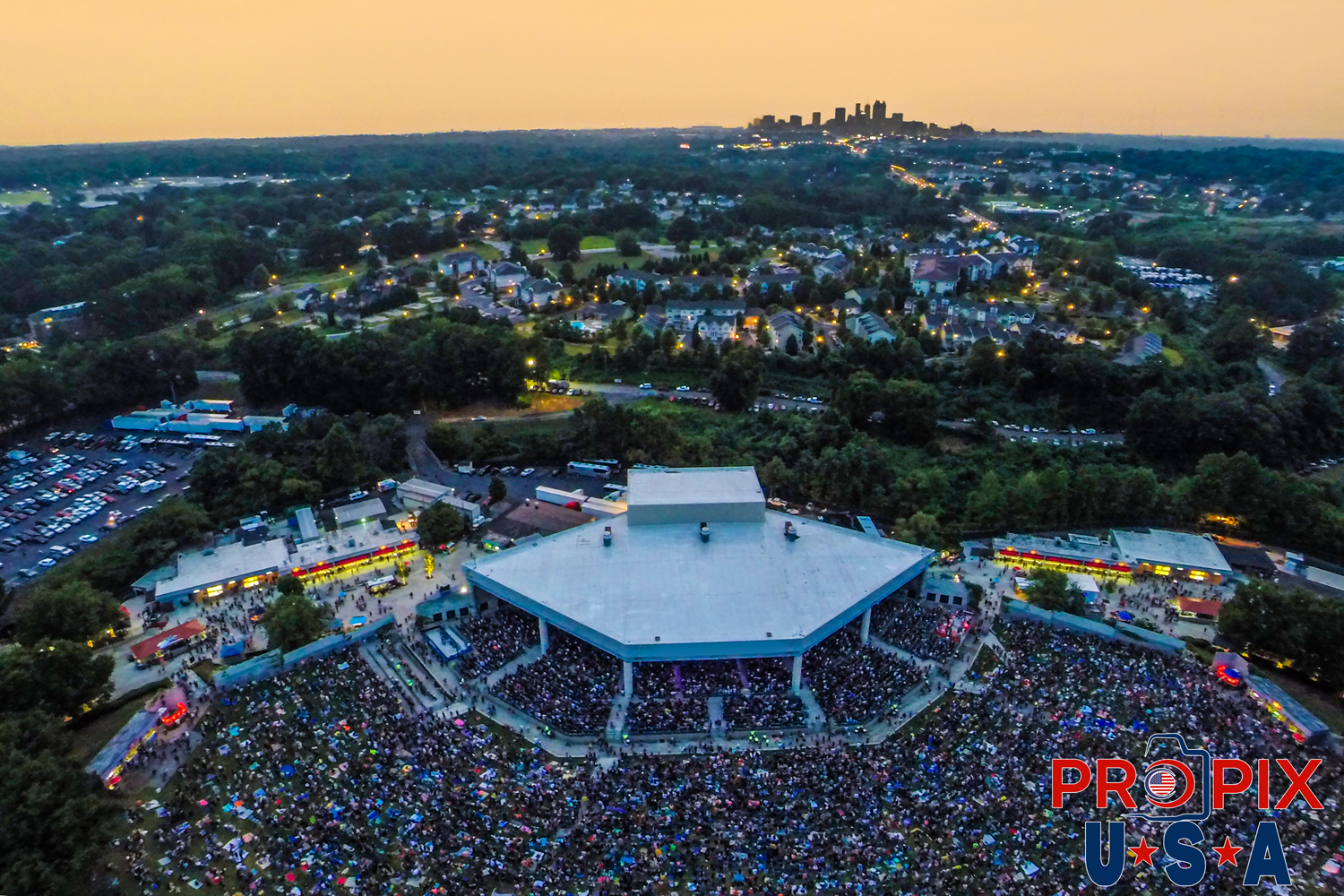 Concert at Lakewood amphitheater with Atlanta skyline at dusk Photo date: 7-18-2014
