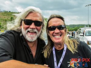 Wild Bill Wichrowski of TV's Deadliest Catch and Iron Maiden's Nicko McBrain laugh it up while hanging out at NHRA's Bristol Tennessee drag race.