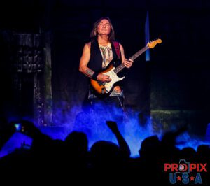 Iron Maiden's Dave Murray immersed in the music that he is able to create with his guitar.