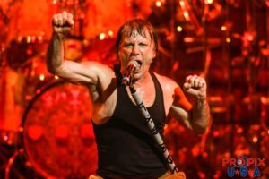 Iron Maiden's Bruce Dickinson belting out an intense performance at one of the Book of Souls World Tour.