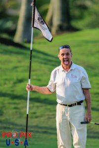 Nicko McBrain of the band Iron Maiden goofing around while enjoying a round of golf during a break from touring.